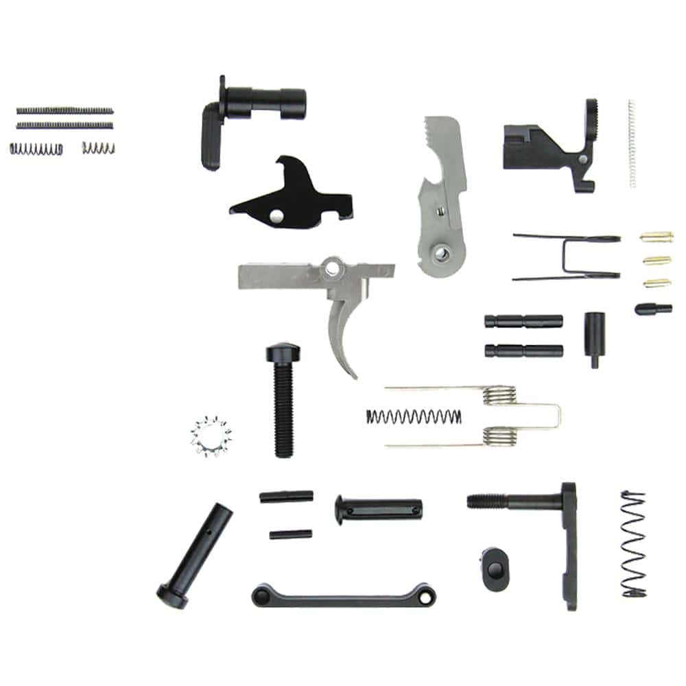 TacFire AR-15 lower parts kit laid out showing trigger, hammer, pins; no grip included