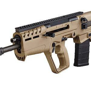 Airsoft M4 rifle with tan finish and tactical rail system.