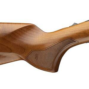 Vintage wooden rifle with metal barrel for hunting and sport shooting.
