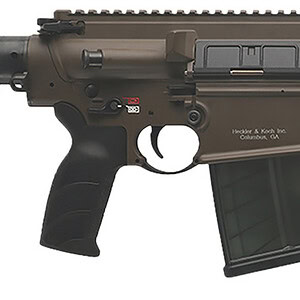 Tactical rifle with adjustable stock, rail system, and magazine for military and law enforcement use.