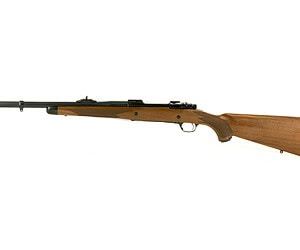 Bolt-action rifle with wooden stock and metal barrel for hunting or sport shooting.