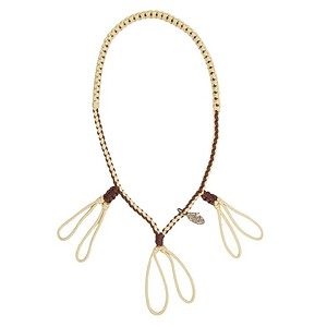 Beaded necklace with leather accents and decorative loops for boho style.