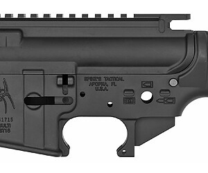 Black tactical rifle lower receiver with safety and trigger components.